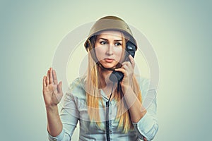 Woman in military helmet talking at phone giving her salute to fuhrer photo