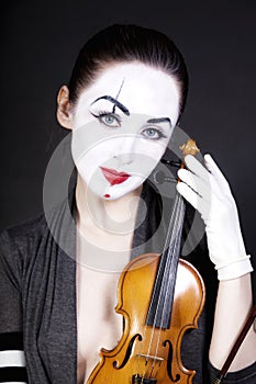 Woman mime with old violin