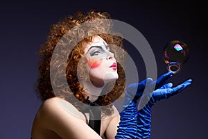 Woman mime with soap bubbles.