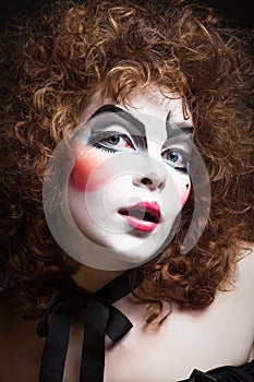 Woman mime with theatrical makeup. Close-up shot