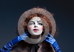 Woman mime with theatrical makeup. Studio shot.