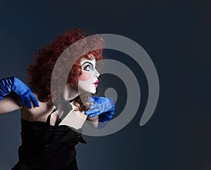 Woman mime with theatrical makeup. Studio shot.