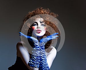 Woman mime with theatrical makeup. Studio shot.