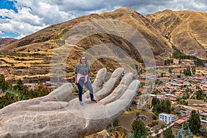 A woman at the Mirador de Cielo Punku viewpoint in Huaro, Cusco, Peru. photo