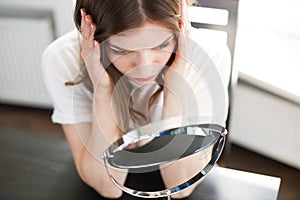 Woman with a mirror photo