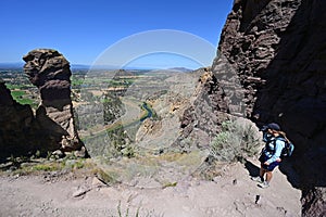 Woman on Misery Ridge Trail in Smith Rock State Park, Oregon.