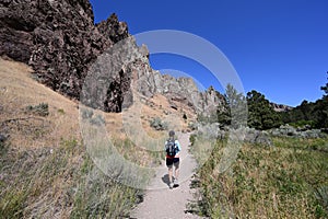 Woman on Misery Ridge Trail in Smith Rock State Park, Oregon.