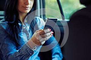 Woman with mobile phone in hand