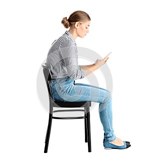 Woman with mobile phone sitting on chair