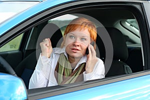 Woman with mobilein a car