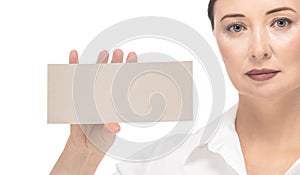 Woman with a mockup in her hand on a white background isolate