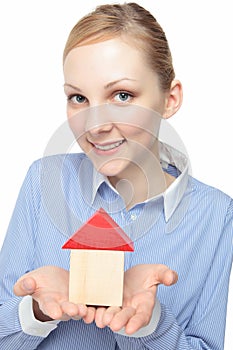 Woman with a model of a house