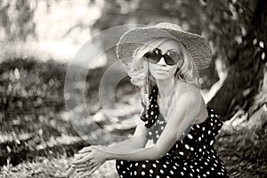 Woman, model in polka dot gown, fashion, old style. Soft focus, retro