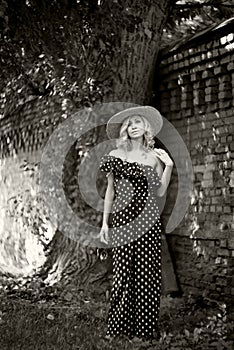 Woman, model in polka dot gown, fashion, old style. Soft focus, retro