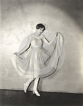 Woman modeling pleated dress