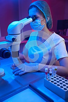 Woman in a modern cryo-laboratory works with biomaterial