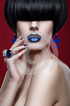 Woman with modern haircut with blue lips