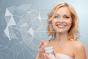 Woman with moisturizer and low poly projection