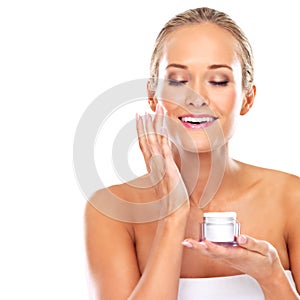 Woman, moisturizer and skincare cream in studio or health treatment as product, wellness or white background. Female