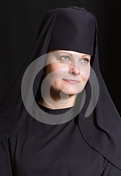 Woman in a monk robe.