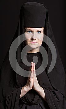 Woman in a monk robe.