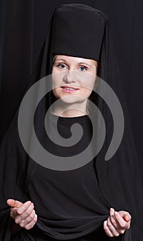 Woman in a monk robe.