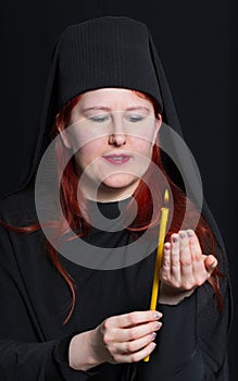 Woman in a monk robe.