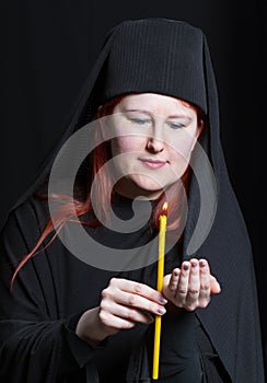 Woman in a monk robe.