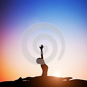 Woman in monkey yoga pose meditating at sunset. Zen