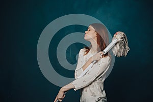 woman mop on blue background gestures with hands emotions Copy Space