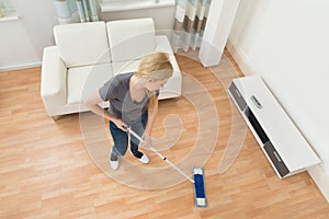 Woman Mopping Floor