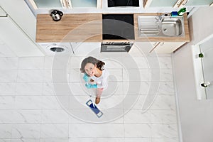 Woman Mopping Floor