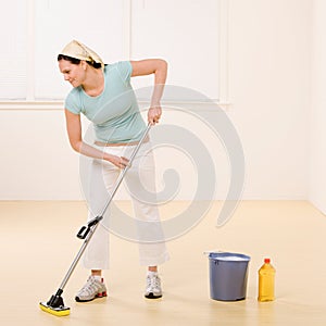 Woman mopping floor with cleaner