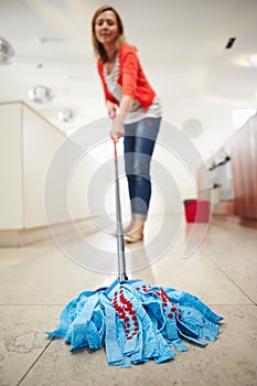 Woman Mopping Kitchen Floor