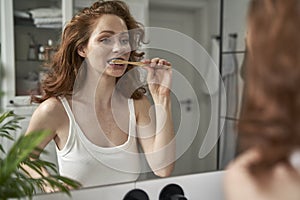 Woman during the morning rutine at the bathroom