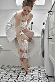 Woman during the morning rutine at the bathroom