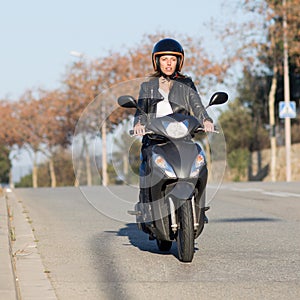 Woman on motor bike driving