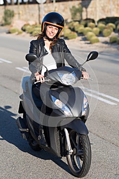 Woman on motor bike driving