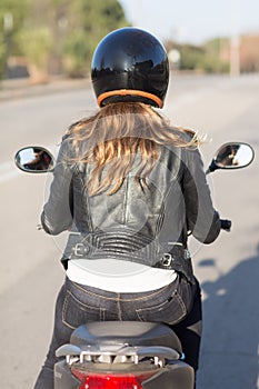 Woman on motor bike driving