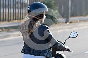 Woman on motor bike driving