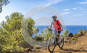 Woman on mountain bike on Elba Island