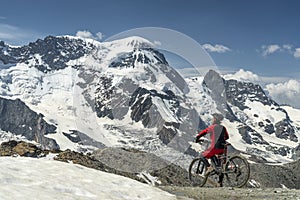 Woman on mountain bike on Gornergrat in Zermatt, Switzerland