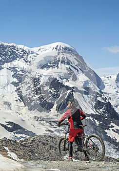 Woman with mountain bike on the Gornergrat in Zermatt, Switzerland