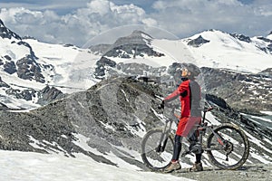 Woman with mountain bike on the Gornergrat in Zermatt, Switzerland