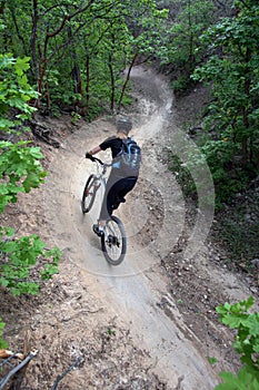 Woman mountain biker / s-curve