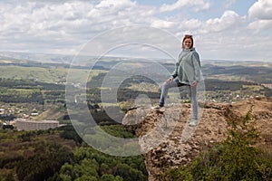 Woman on a mountain cliff