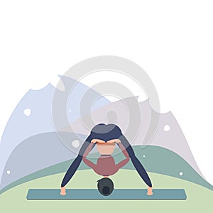 A woman in the mountains does yoga in Prasarita Padottanasana, standing with her legs wide apart. Can be used for poster