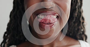 Woman, mouth and lick teeth for dental, health and wellness with cleaning for plaque on white background. Oral hygiene