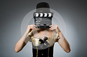 Woman with movie clapboard