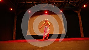 A Woman moving her hands while dancing lonely with the energy of anger